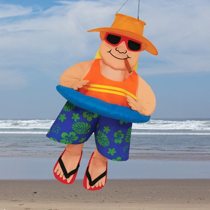 Float Man With Cigar Wind Friend staged outdoors, bringing a quirky charm to a yard or garden setting.