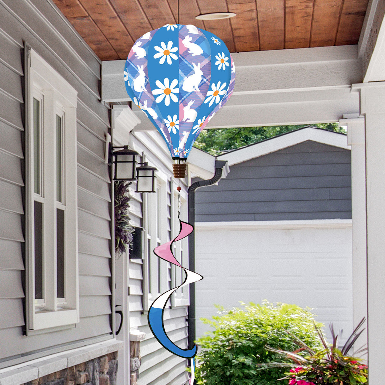 Hot air balloon spinner with spring bunnies, Easter florals, and pastel colors, crafted from weather-resistant polyester for cheerful outdoor garden décor.