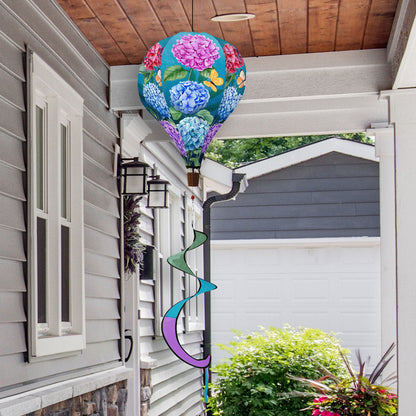 Hot air balloon spinner with watercolor hydrangeas, durable polyester fabric, and breezy motion for charming spring and summer outdoor floral décor.