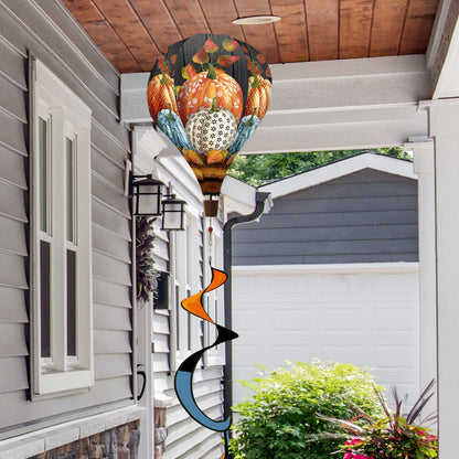 Hot air balloon spinner with soft-toned pumpkins and subtle autumn accents, made of weather-resistant polyester for elegant fall garden or porch decoration.
