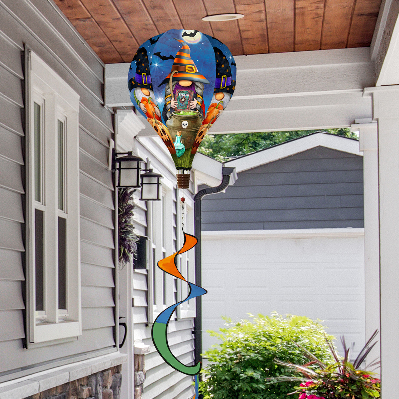 Hot air balloon spinner with Halloween gnomes, jack-o'-lanterns, and spooky fall design, made of weather-resistant polyester for vibrant outdoor seasonal décor.