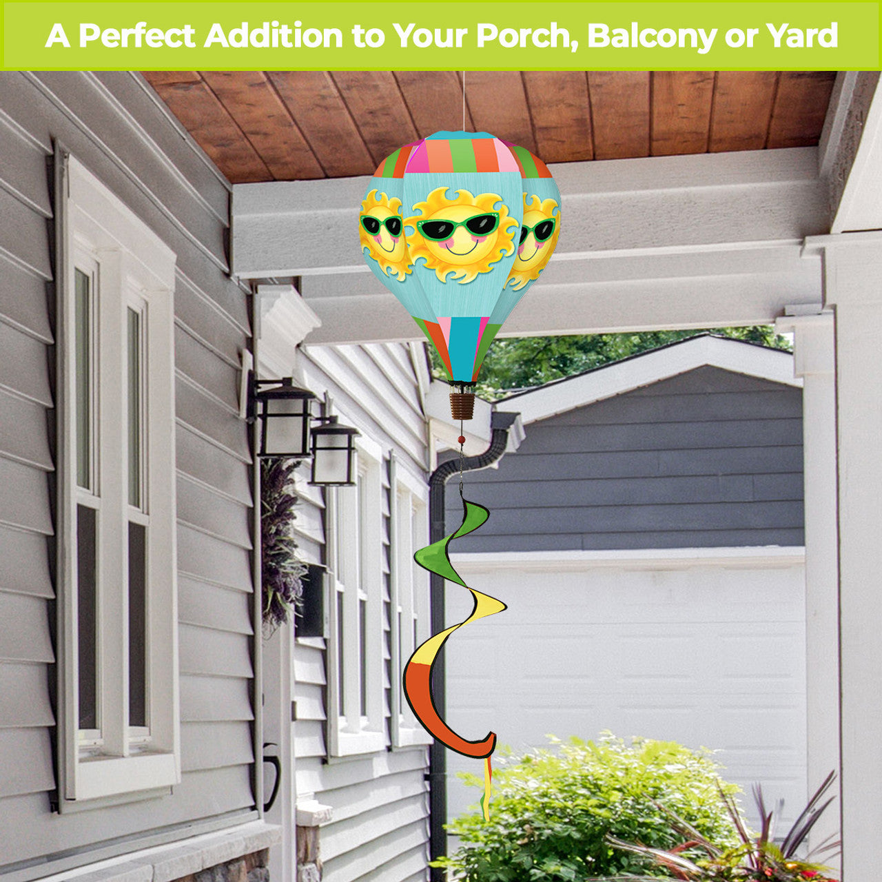 Hot air balloon spinner with smiling sun design and bright summer hues, made from weather-resistant polyester for playful outdoor seasonal garden décor.