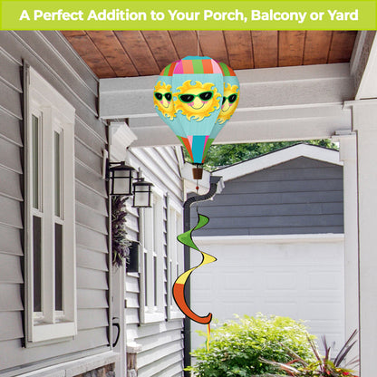 Hot air balloon spinner with smiling sun design and bright summer hues, made from weather-resistant polyester for playful outdoor seasonal garden décor.