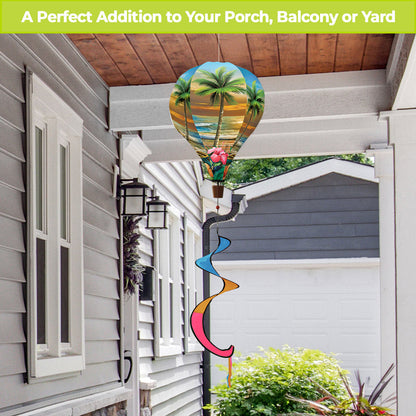 Hot air balloon spinner with glowing sunset design, island palms, and durable spinning tail for colorful tropical-inspired outdoor garden or patio décor.