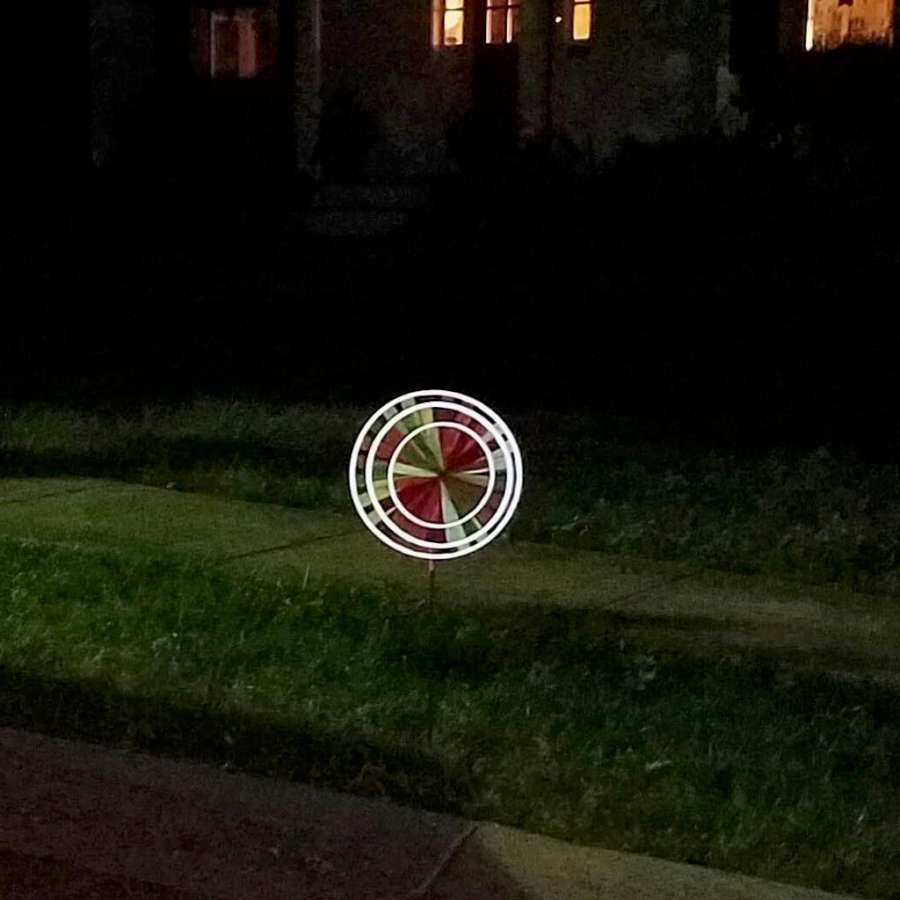 Reflective triple spinner with layered wheels, fade-resistant SunTex™ fabric, and light-catching accents—perfect for bright daytime color and glowing nighttime effect.