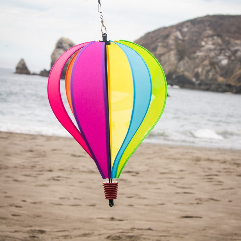 Fiesta 6-Panel Fabric Hot Air Balloon staged outdoors, adding a colorful and festive touch to a yard or garden.