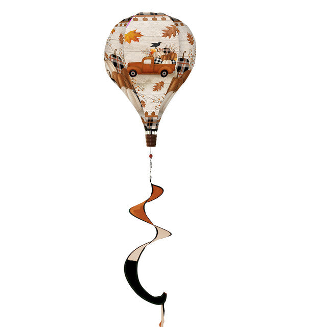 Hot air balloon spinner with vintage pickup truck, pumpkins, and fall florals, made of weather-resistant polyester for breezy, festive autumn outdoor décor.