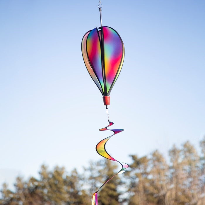 Jewel 6-Panel Hot Air Balloon displayed outdoors, showcasing its radiant jewel-inspired colors against a picturesque sky.