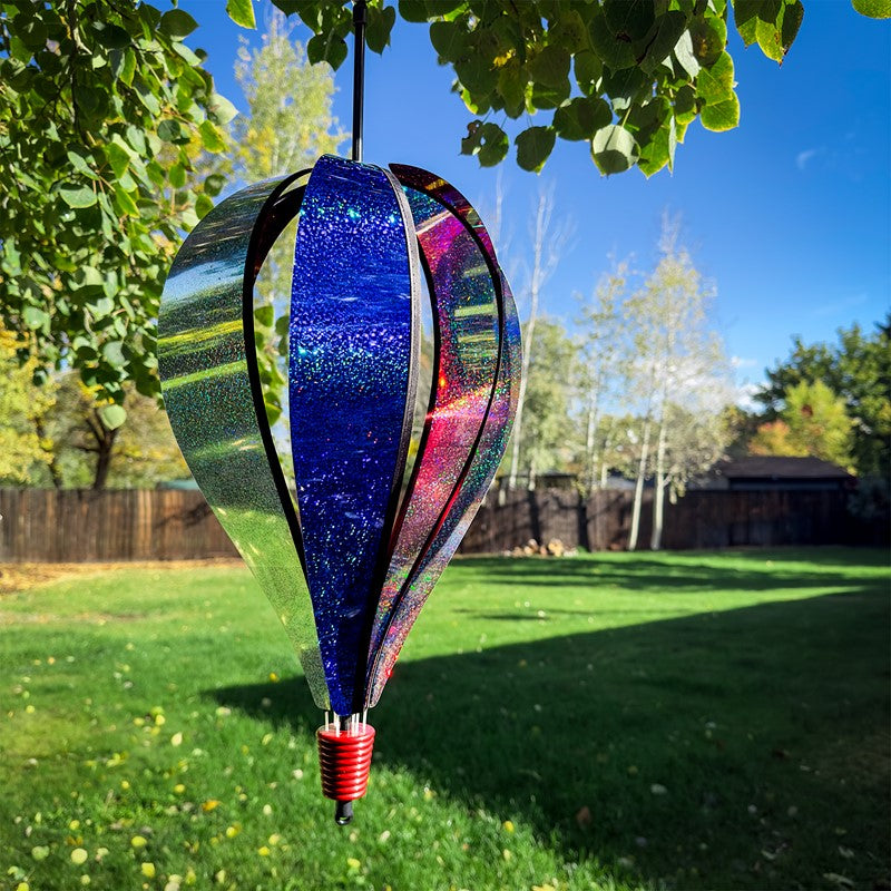 Patriot Sparkler 6-Panel Hot Air Balloon soaring outdoors, highlighting its vibrant patriotic sparkler design against a clear sky.