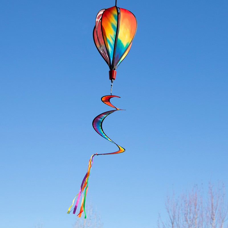 Tie Dye 6-Panel Hot Air Balloon displayed outdoors, highlighting its eye-catching tie-dye colors against a scenic open sky.