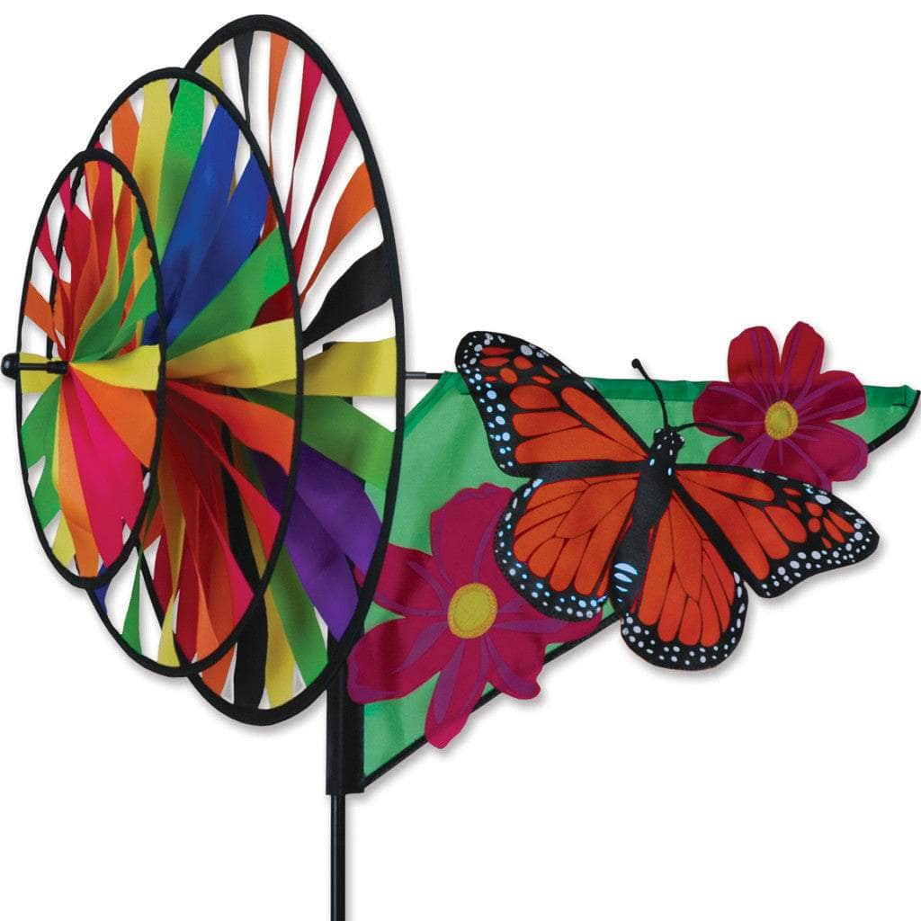 Triple spinner featuring monarch butterfly with fade-resistant SunTex™ fabric and three wheels for layered motion in vibrant garden displays.